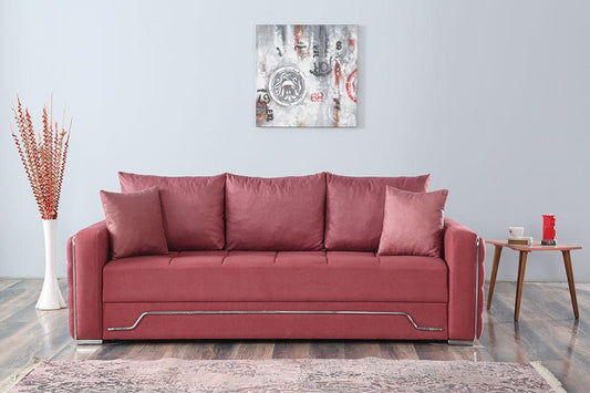 Czerwona sofa z prostymi podłokietnikami w nowoczesnym wnętrzu.
