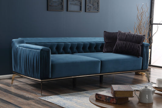 Granatowa sofa welurowa z ozdobnymi pikowaniami w luksusowym wnętrzu