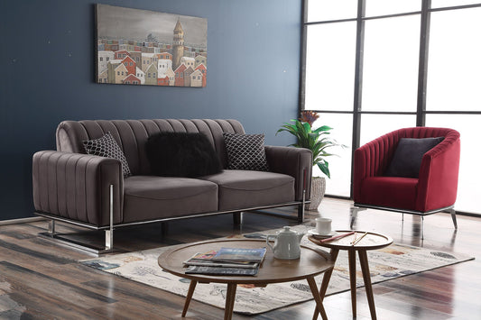 Ciemnobrązowa sofa z pikowaniem w eleganckim salonie.