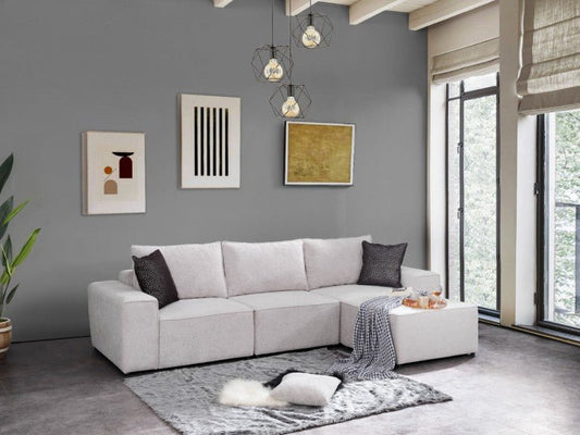Jasnoszara narożna sofa w minimalistycznym salonie