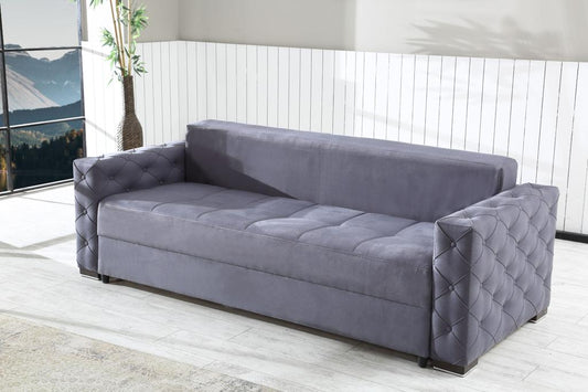 Ciemnoszara sofa w minimalistycznym, jasnym salonie